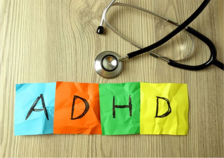 image of adhd written on sticky notes and a stethoscope on a table